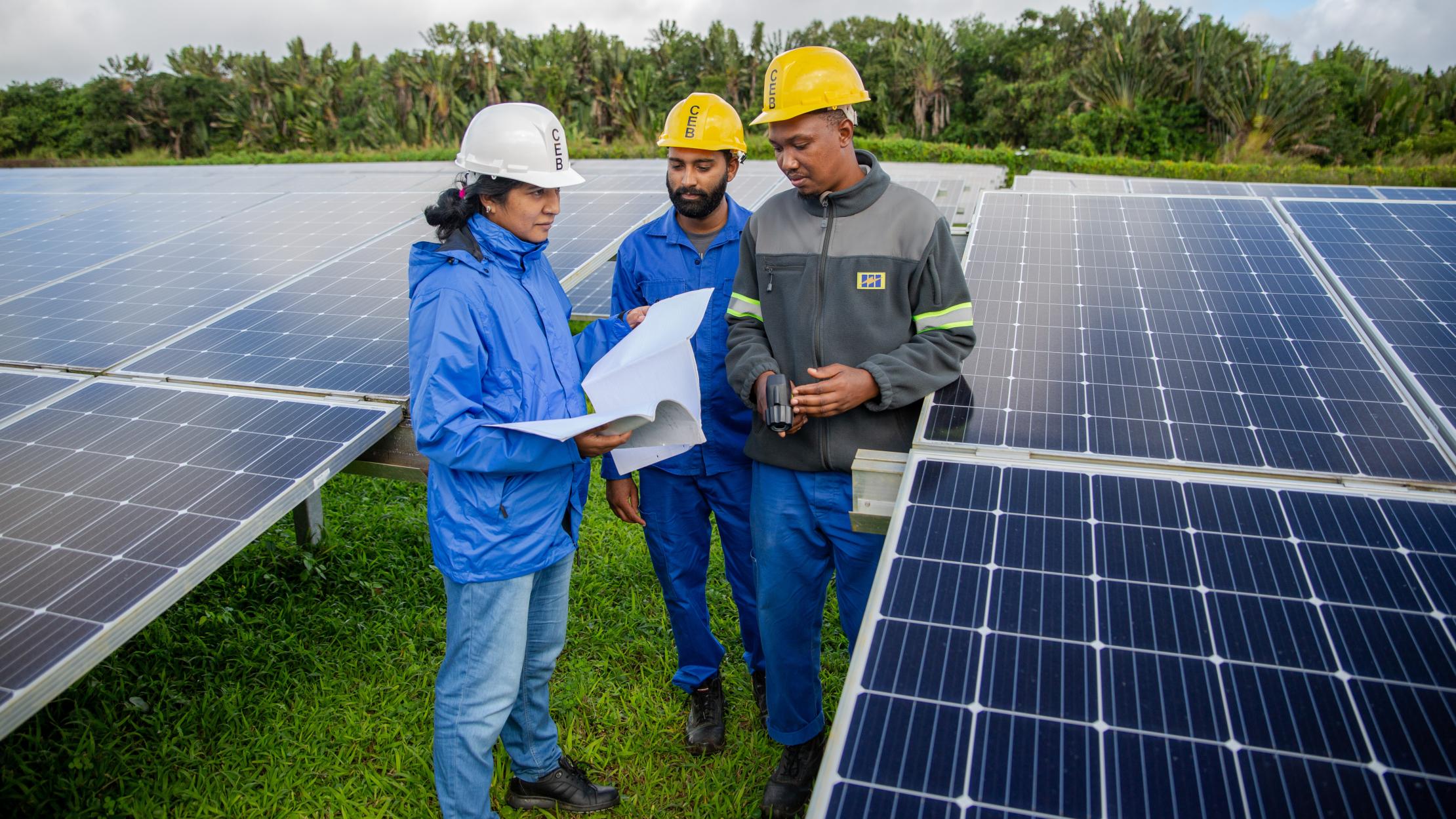 Photo: UNDP Mauritius and Seychelles Woman engineer working with a team on installation of solar panels in Mauritius and the Seychelles